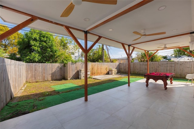 view of patio featuring ceiling fan