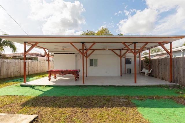 exterior space with a patio area, a yard, and ceiling fan