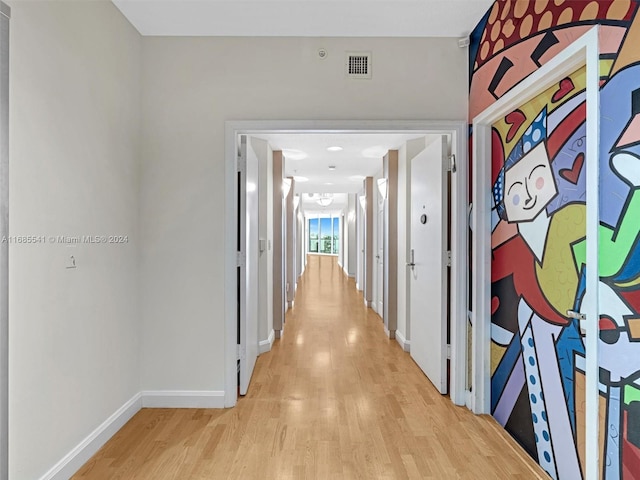 corridor with light wood-type flooring