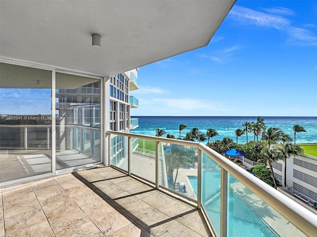 balcony featuring a water view