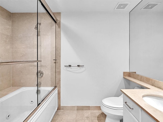 full bathroom with vanity, toilet, tile patterned floors, and shower / bath combination with glass door