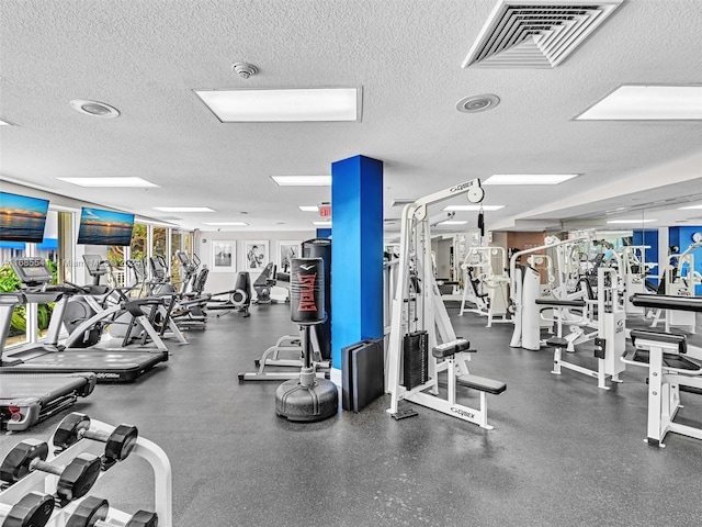 workout area with a textured ceiling