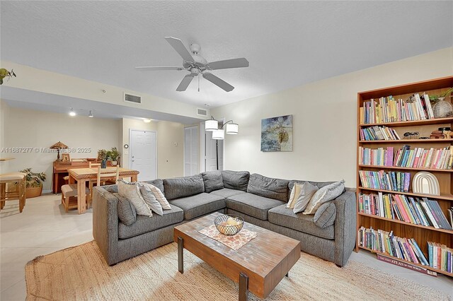 519 E Sheridan St Unit 106, Dania Beach, FL 33004 - living room with light tile patterned flooring and a ceiling fan