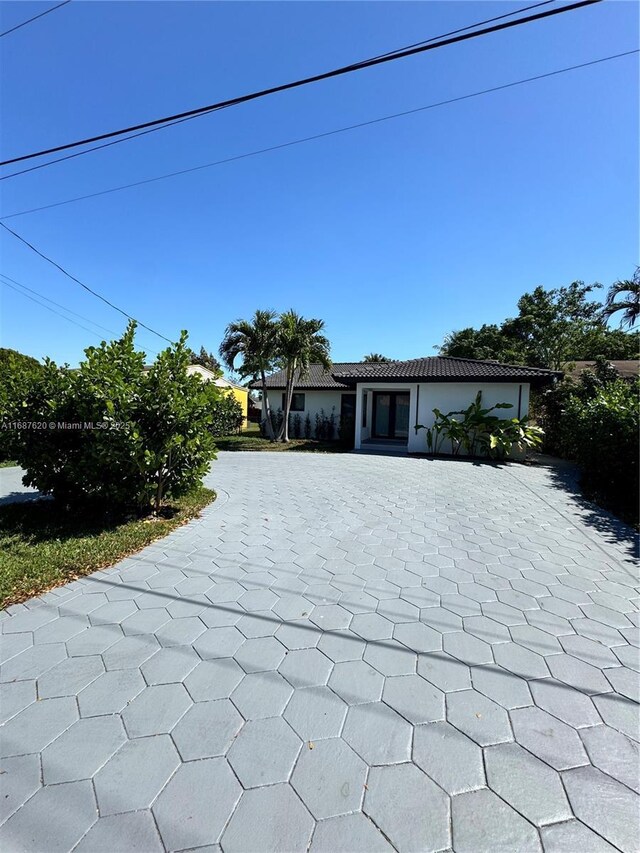 rear view of property featuring a patio and french doors