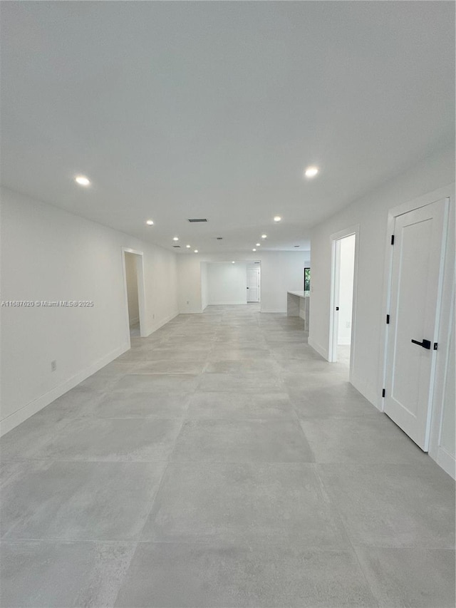 interior space featuring recessed lighting and concrete flooring