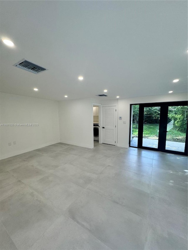 unfurnished room featuring washer / dryer