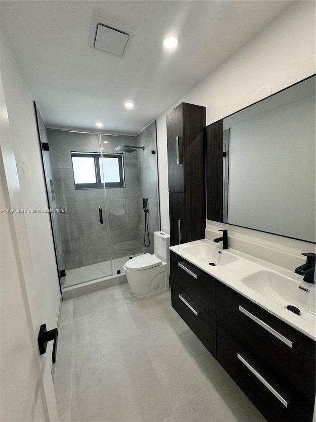 bathroom featuring vanity, toilet, and walk in shower