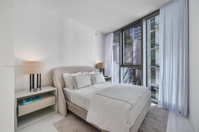 bedroom featuring floor to ceiling windows