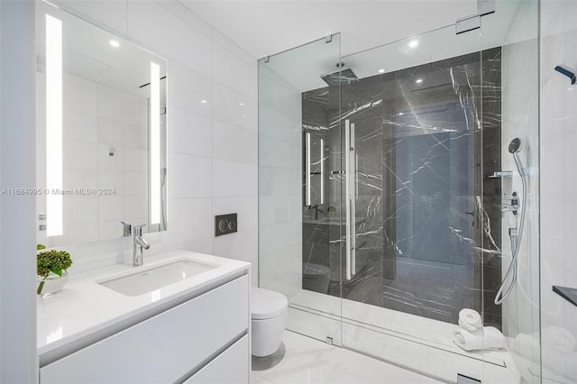 bathroom featuring tile walls, vanity, toilet, and walk in shower