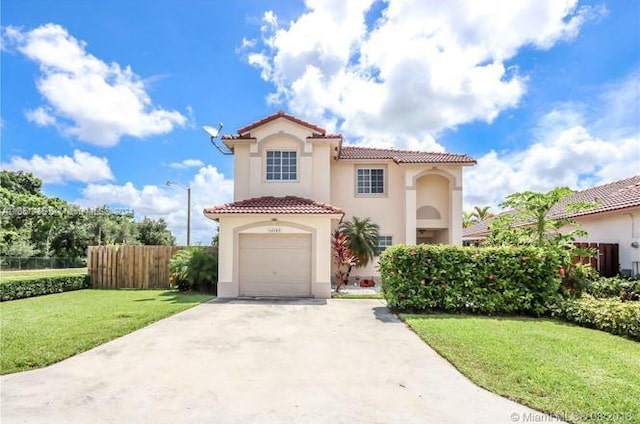 mediterranean / spanish-style house with a front lawn and a garage