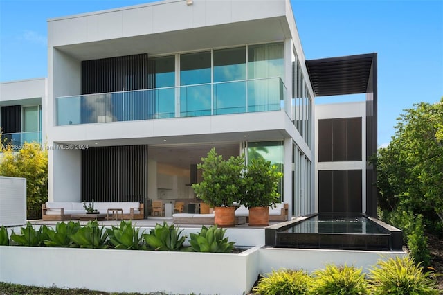 tiled living room featuring a wall of windows