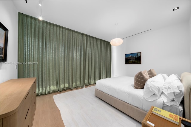 bedroom with light wood-type flooring