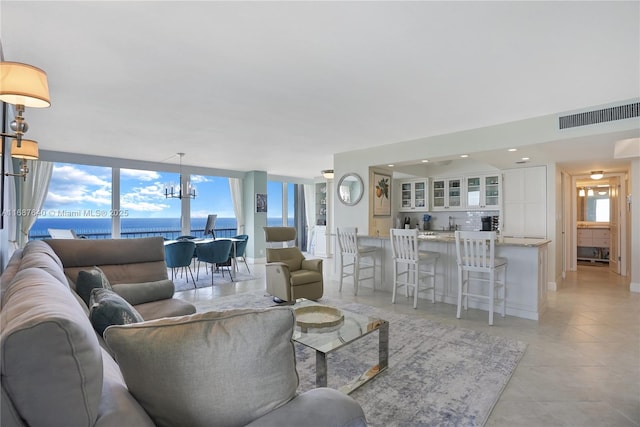 tiled living room with a water view