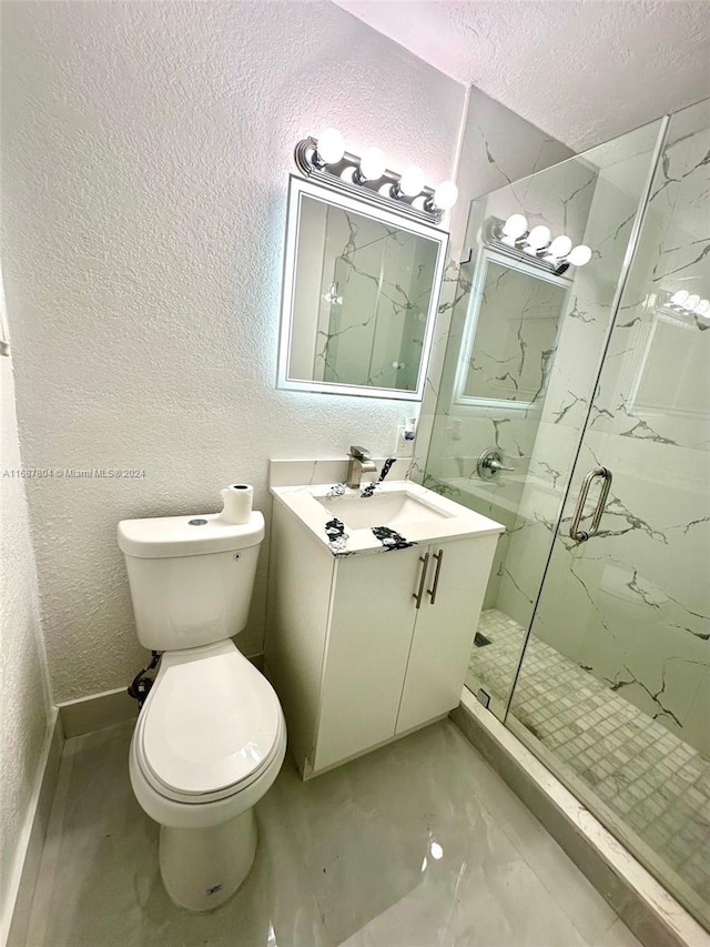 bathroom with vanity, a textured ceiling, toilet, and a shower with door