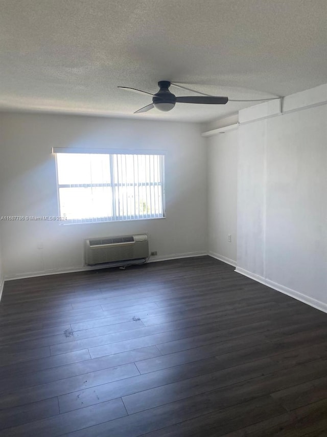 400 Kings Point Dr Unit 911, Sunny Isles Beach, FL 33160 - unfurnished room with a ceiling fan, a wall mounted air conditioner, dark wood-style flooring, and a textured ceiling