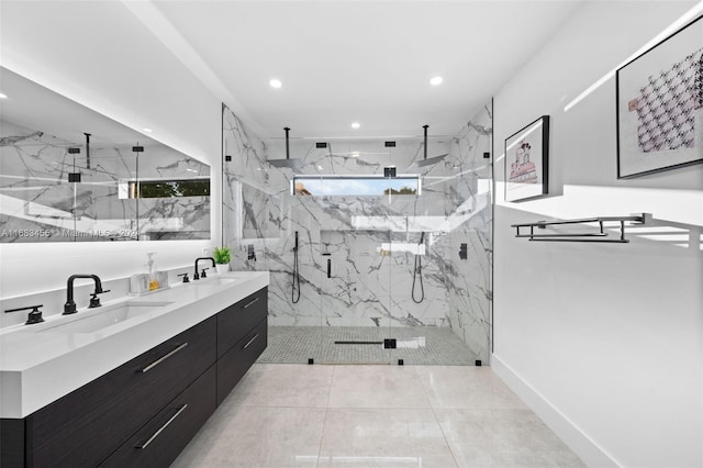 bathroom featuring walk in shower, vanity, and tile patterned floors