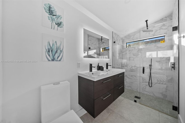 bathroom featuring walk in shower, lofted ceiling, vanity, and tile patterned flooring