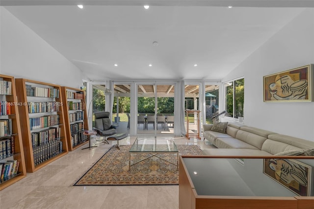 living room with vaulted ceiling and recessed lighting