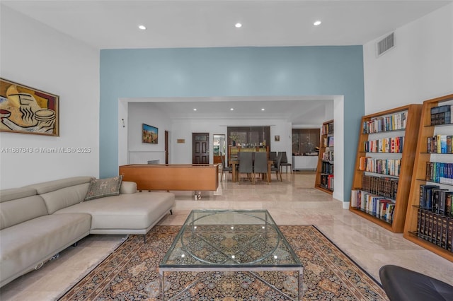 living area featuring marble finish floor, visible vents, and recessed lighting