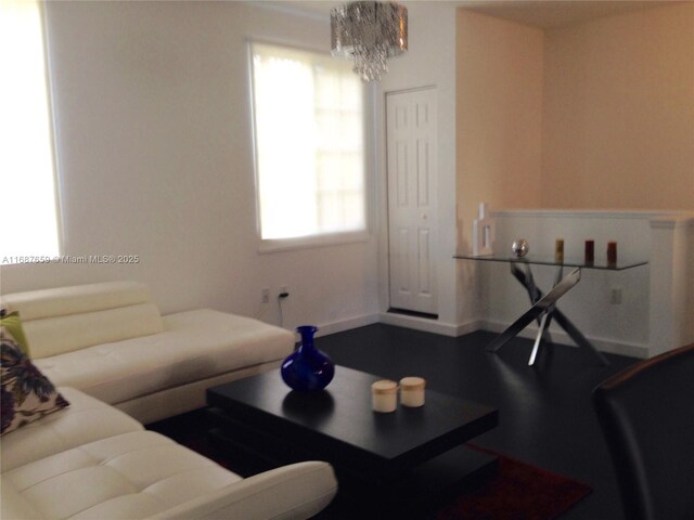 living room with dark hardwood / wood-style flooring