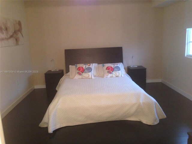 bedroom featuring hardwood / wood-style floors