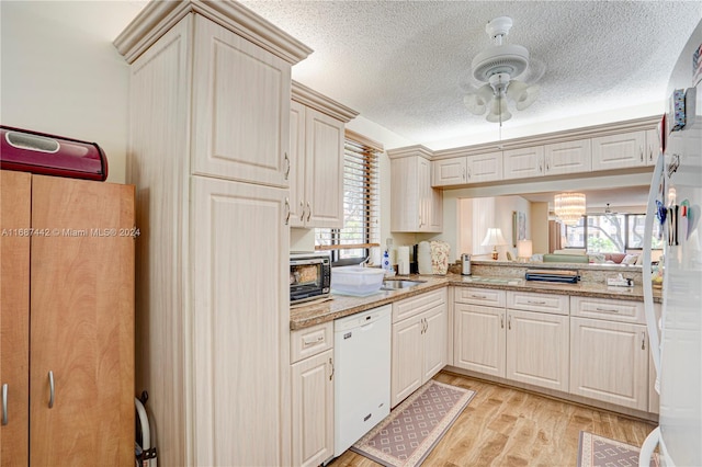 kitchen with light stone counters, a textured ceiling, ceiling fan, light wood-type flooring, and white appliances