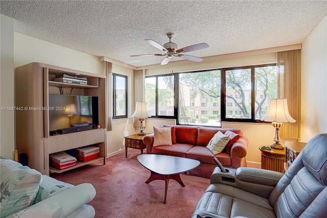 living room featuring a wealth of natural light, ceiling fan, a textured ceiling, and carpet flooring