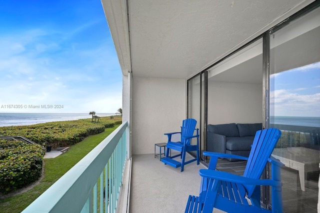 balcony featuring a water view