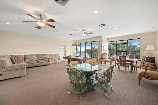 dining area featuring ceiling fan, a textured ceiling, billiards, and carpet