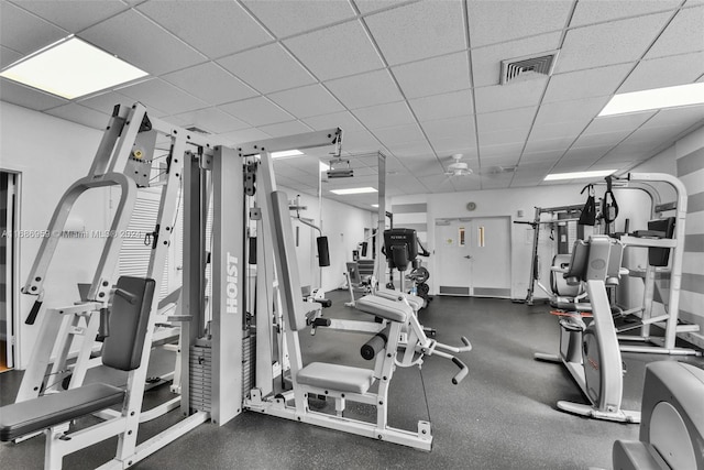 exercise room featuring a paneled ceiling