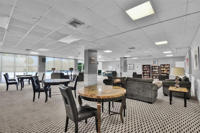 interior space featuring a drop ceiling