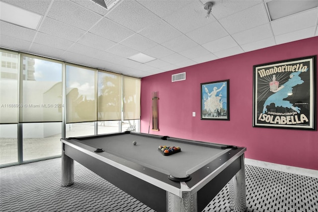 playroom with a wall of windows, pool table, a paneled ceiling, and carpet floors