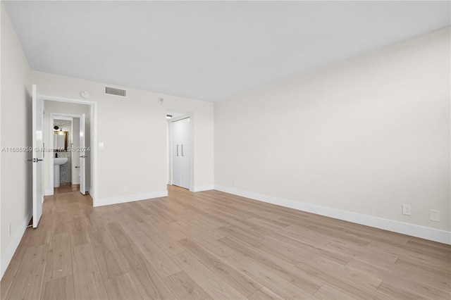 unfurnished room featuring light wood-type flooring