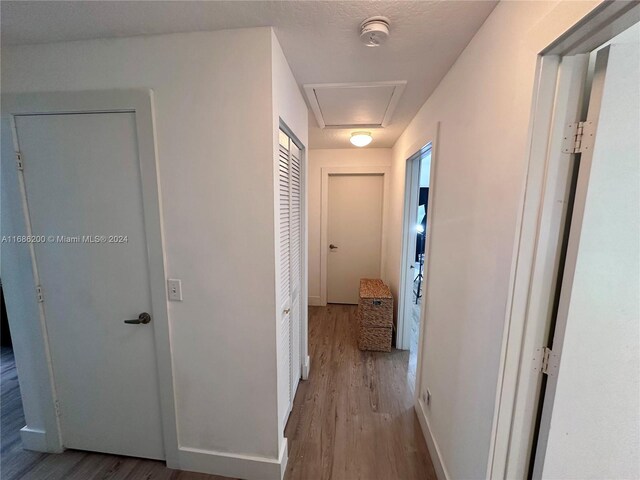 hallway featuring hardwood / wood-style flooring