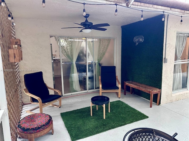 view of patio featuring ceiling fan