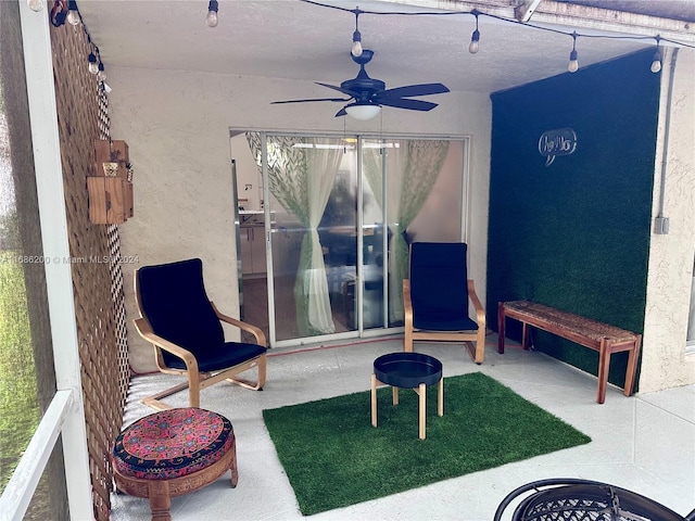 view of patio featuring ceiling fan