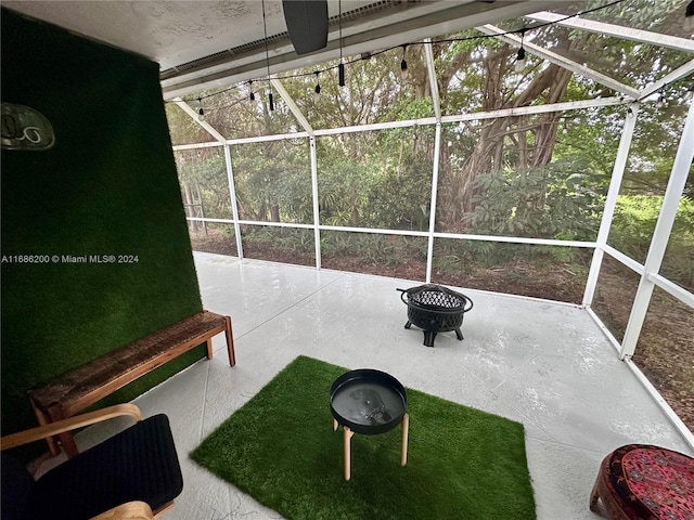 view of patio / terrace featuring a lanai