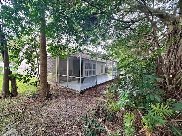 exterior space featuring a sunroom and a patio area