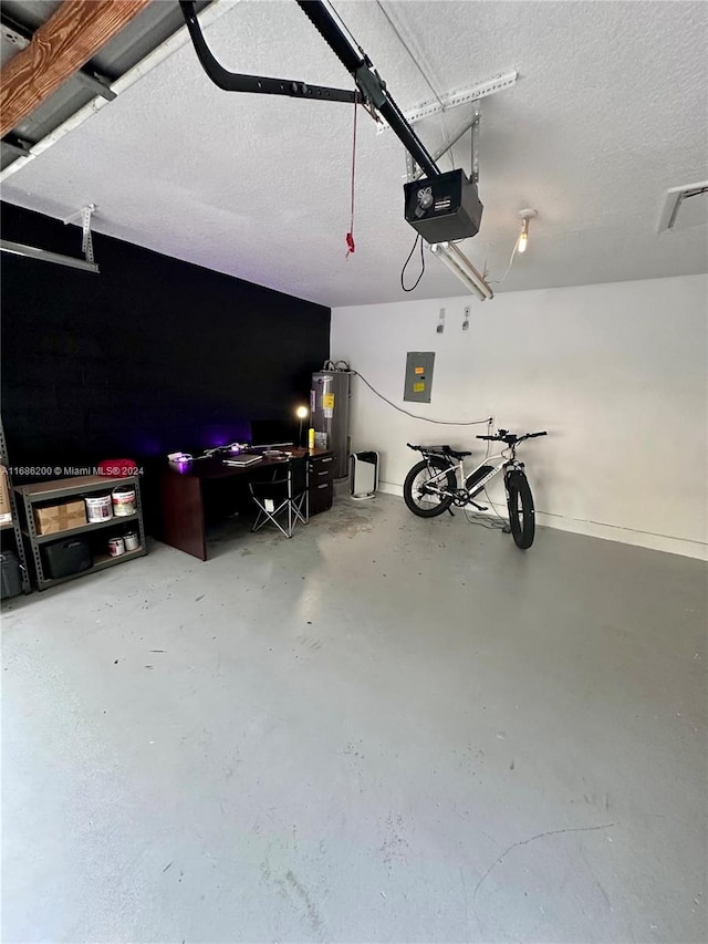 garage featuring a garage door opener, electric panel, and water heater