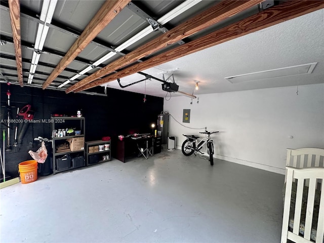 garage with a garage door opener, electric water heater, and electric panel