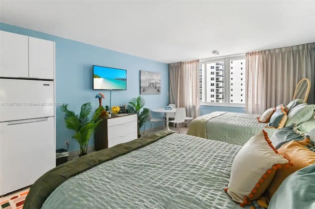 19201 Collins Ave Unit 801, Sunny Isles Beach, FL 33160 - bedroom with freestanding refrigerator