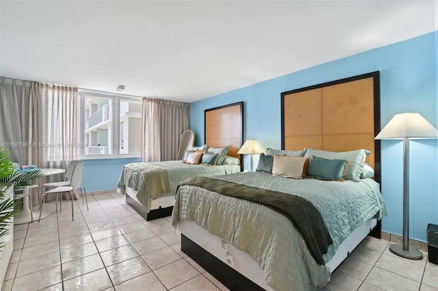 bedroom with light tile patterned floors