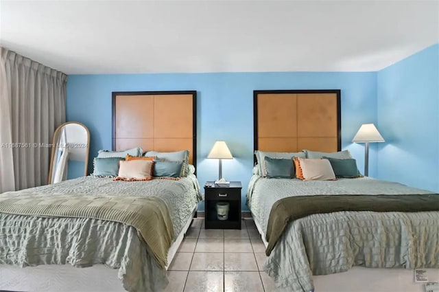 bedroom featuring light tile patterned flooring