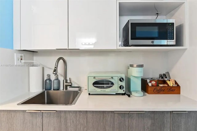 kitchen with sink and white cabinets