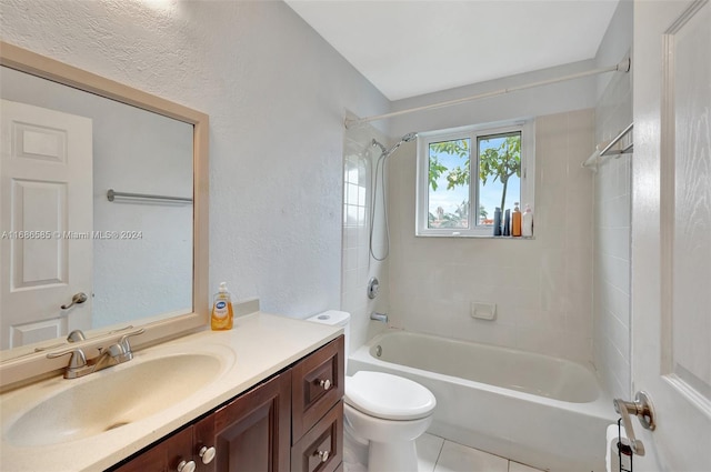 full bathroom with toilet, vanity, tiled shower / bath combo, and tile patterned floors