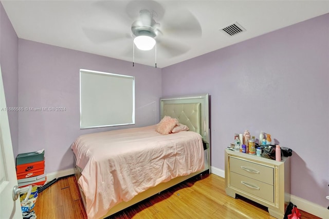 bedroom featuring light wood-type flooring and ceiling fan