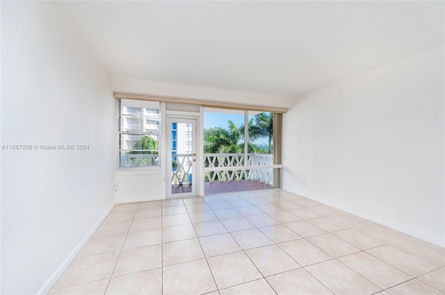 unfurnished room featuring light tile patterned flooring