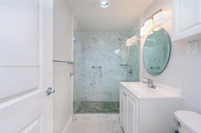 bathroom featuring toilet, an enclosed shower, and vanity