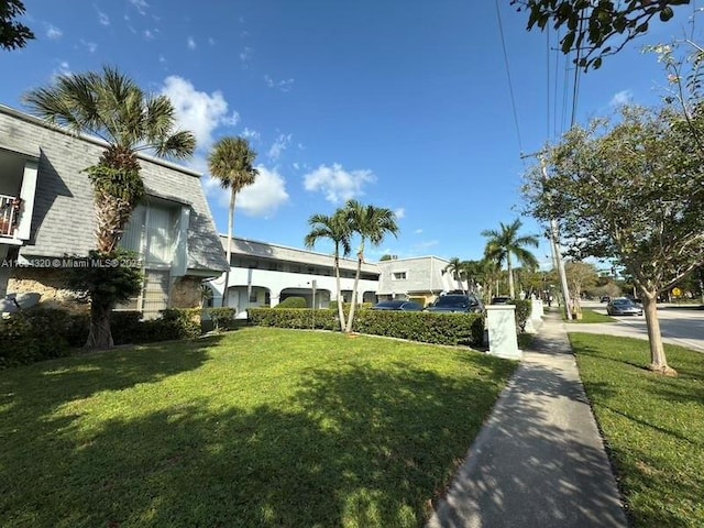 view of community featuring a lawn