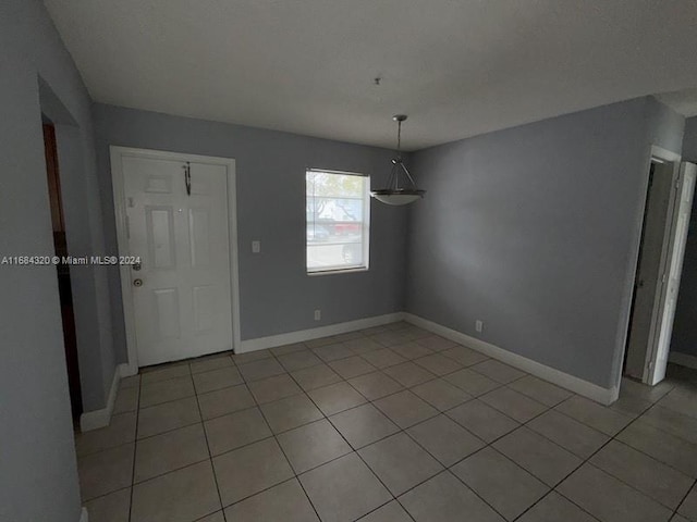 unfurnished dining area with light tile patterned floors